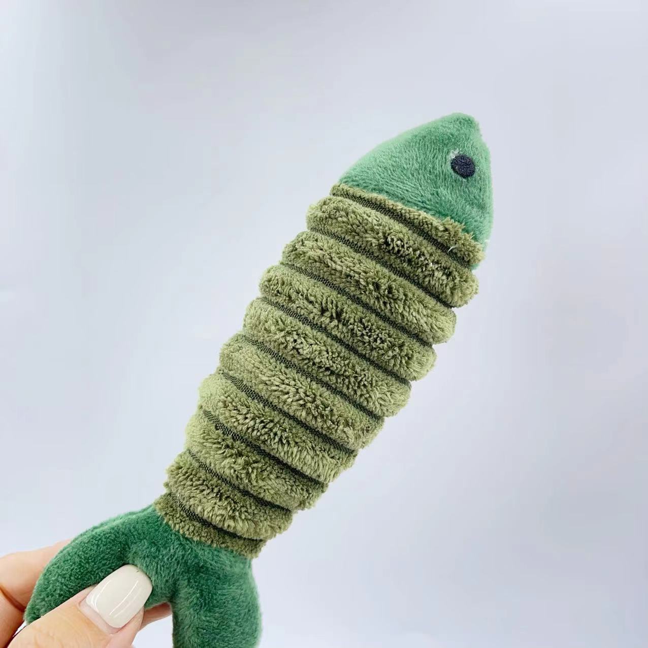 CJ plush catnip fish toy for cats, soft and colorful with a fish shape, designed to entertain and stimulate feline play.