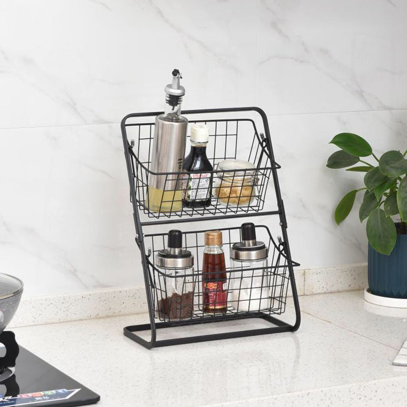 Stainless steel multilayer spice rack and fruit storage shelf in a kitchen, organized on a sleek kitchen storage rack by CJ.