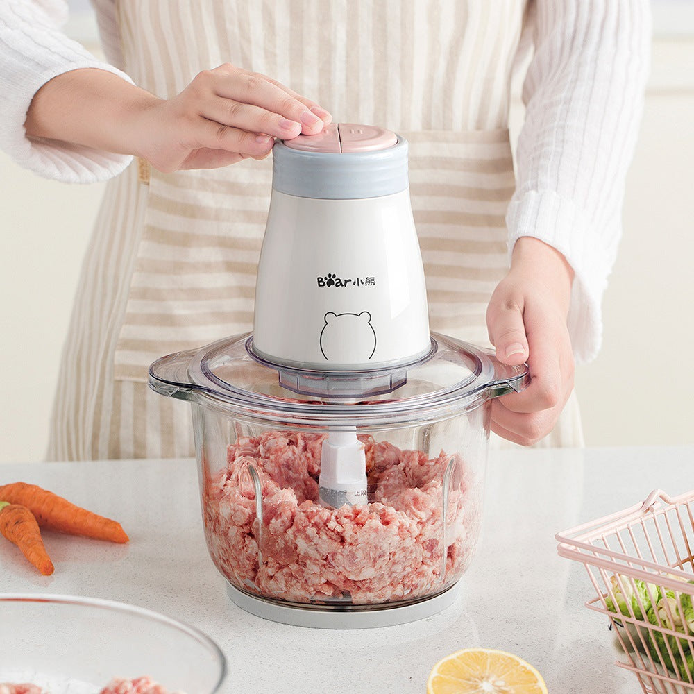 CJ household electric vegetable chopper and blender with compact design, featuring stainless steel blades for efficient food processing.