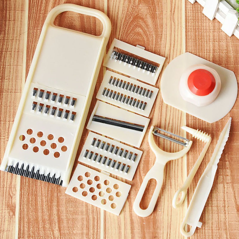 CJ household multi-function vegetable chopper 11-piece set with ginger and garlic smashing device, showing the various chopping tools.