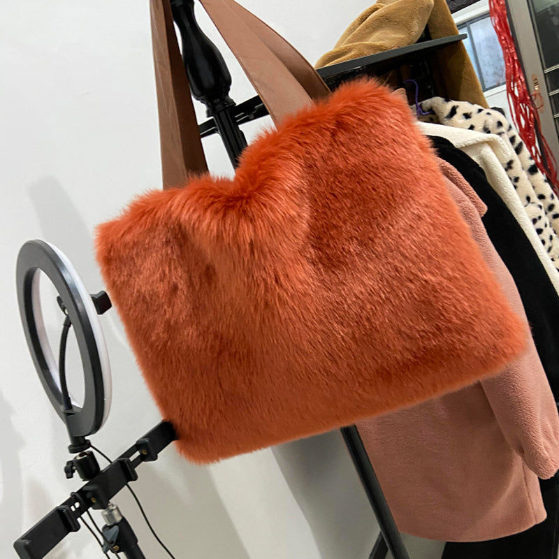 CJ women's plush shoulder bag with soft fur exterior, stylish handbag for women, featuring a cozy, fashionable design.