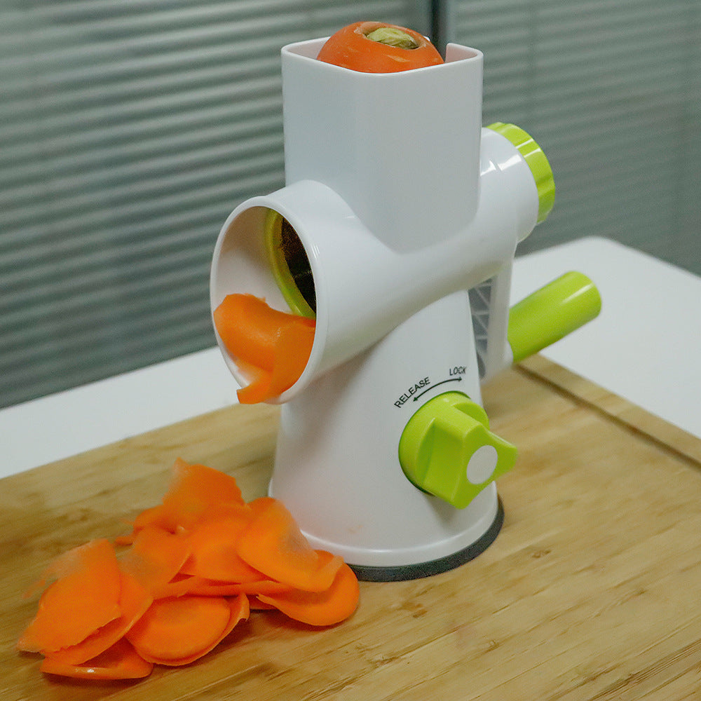 CJ kitchen roller multi-function vegetable chopper with stainless steel blades on a wooden countertop.