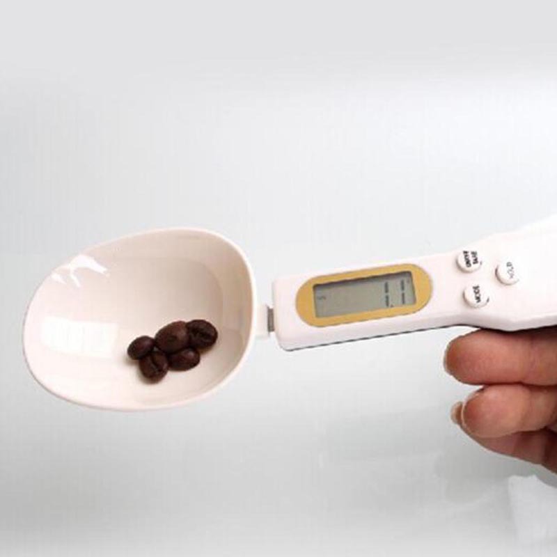 CJ LCD digital kitchen scale measuring food weight with a spoon for coffee, tea, sugar, and cooking ingredients.