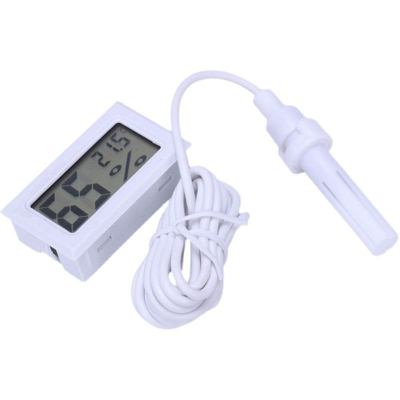 CJ embedded digital thermometer and hygrometer with probe showing a digital display of temperature and humidity levels.