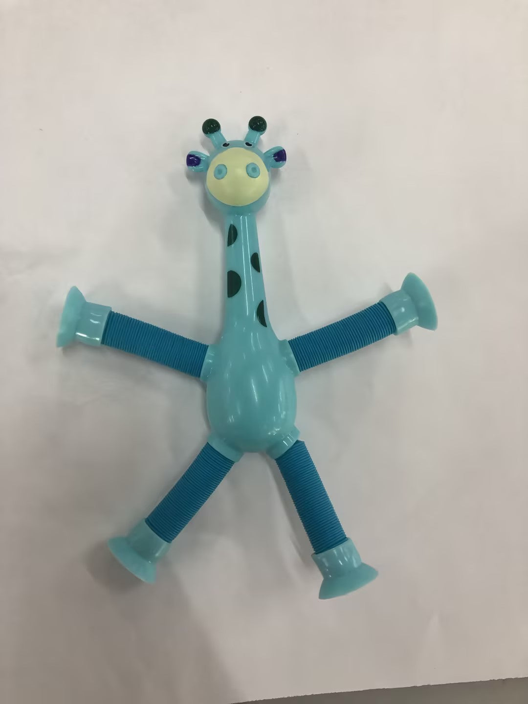 CJ giraffe-shaped sensory fidget toy with stretchy spring tubes for stress relief and sensory stimulation, ideal for kids and party favors.