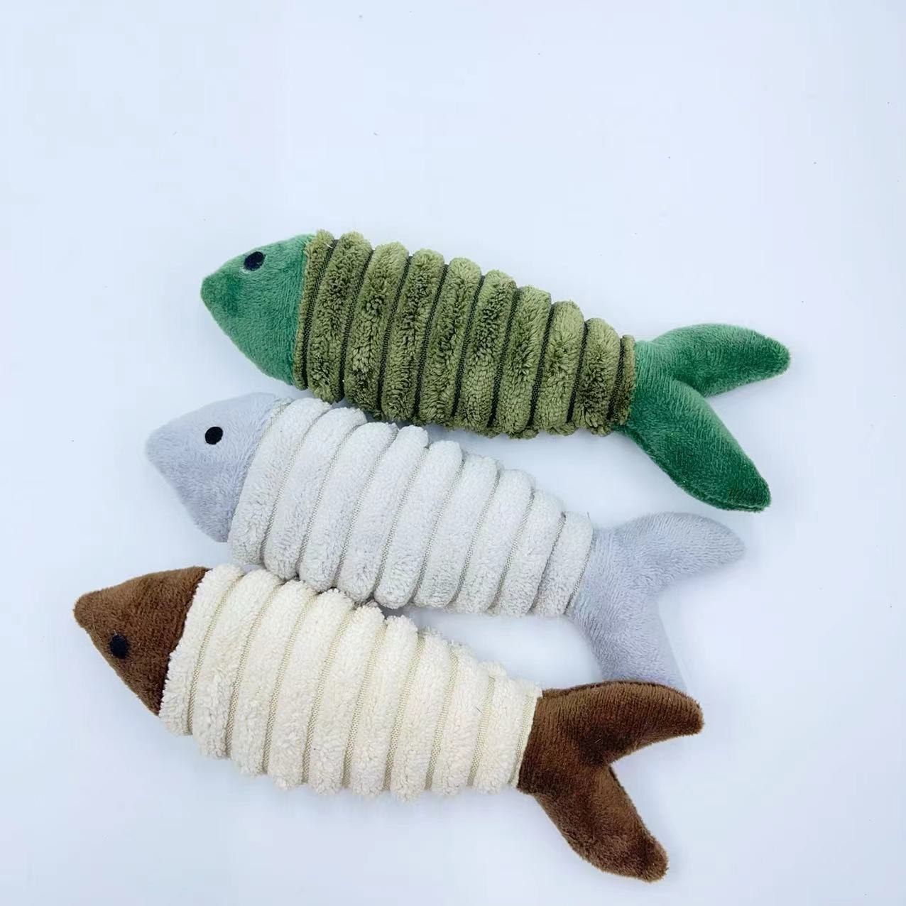 CJ plush catnip fish toy for cats, soft and colorful, designed to entertain and stimulate feline play.