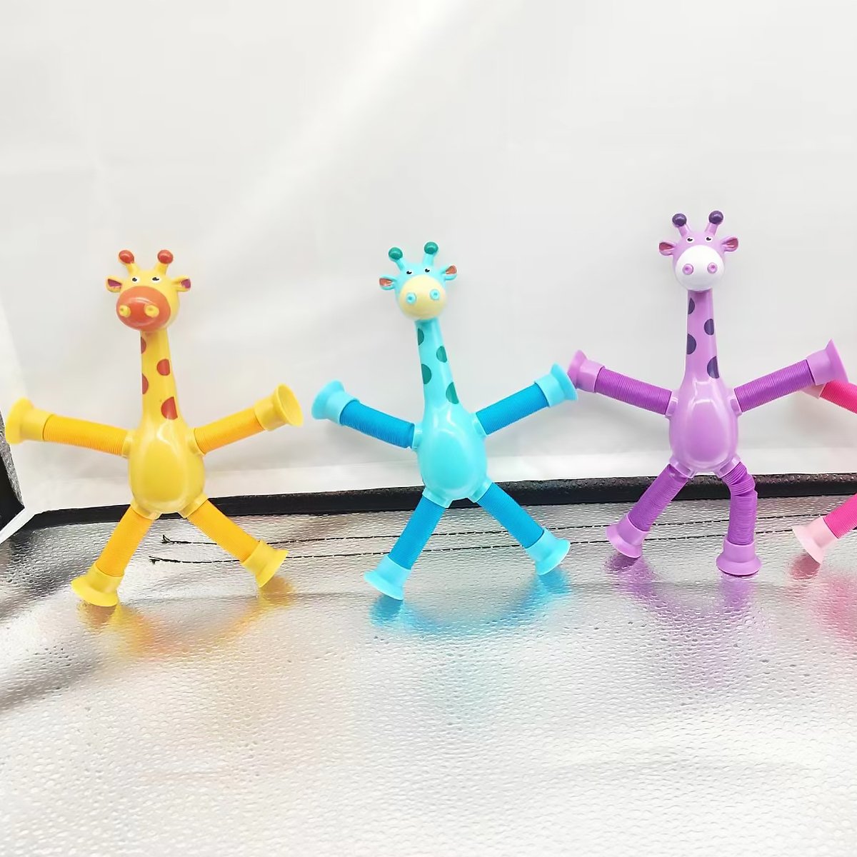 CJ Giraffe Tubes sensory fidget toy with stretchy spring design, ideal for stress relief, kids' birthday gifts, and party favors.