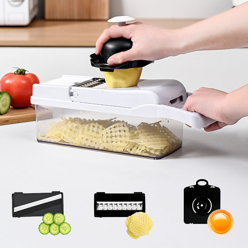 CJ multi-function vegetable chopper with stainless steel blades and plastic handle, shown on a kitchen countertop.