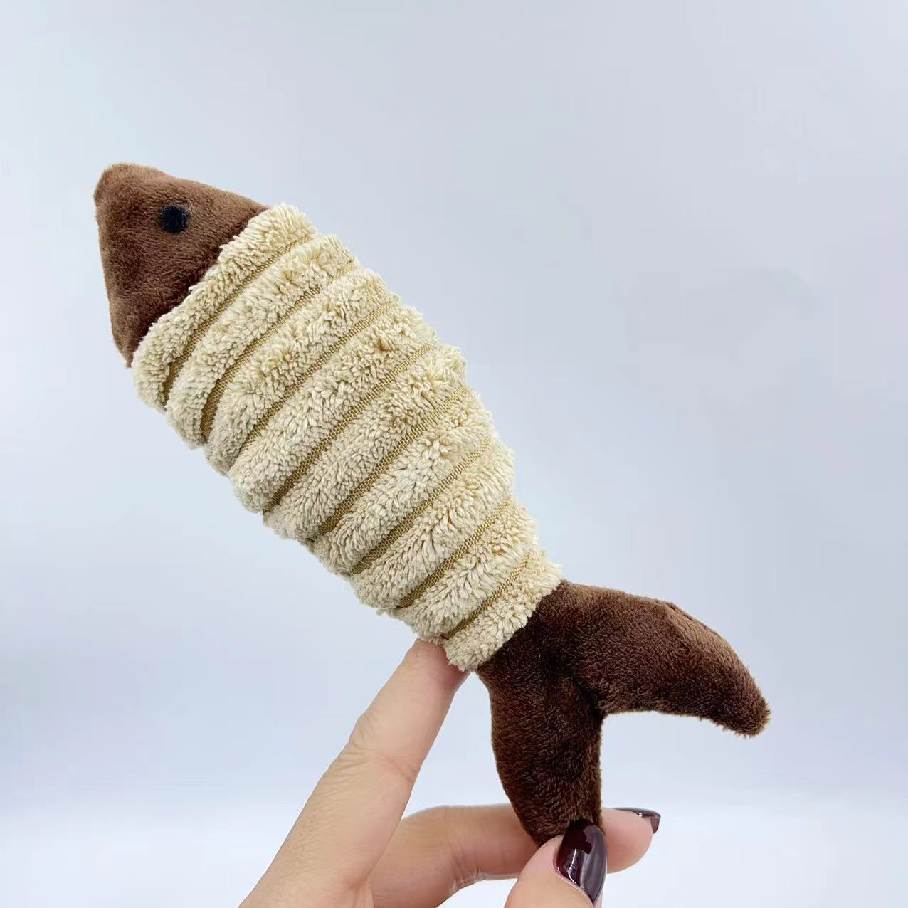 Soft plush catnip fish toy for cats by CJ, designed for play and entertainment with colorful, textured fabric.
